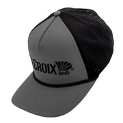 Side of a grey hat with a black back and a black st. croix logo on the front.