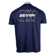 Navy blue t-shirt with white text on the back that says "decades in the making, seviin."