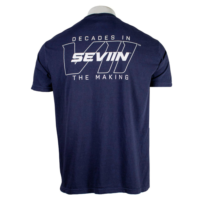Navy blue t-shirt with white text on the back that says "decades in the making, seviin."