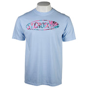 A light blue crewneck t-shirt that featurs a chest graphic containing the 'ST CROIX' logo in a pink and teal floral patterned design.