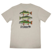 A light beige crewneck t-shirt shown from the back, featuring a graphic print of three green and orange fish and the St. Croix logo.